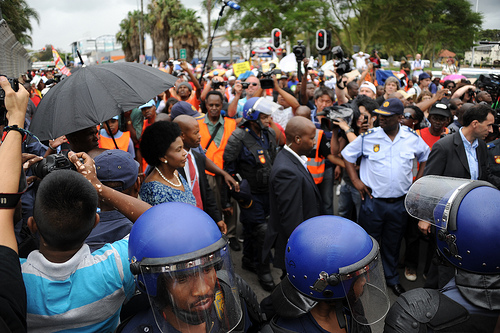 Protesters rallied in Durban and cities around the U.S. demanding that the "world's biggest polluter" start supporting climate solutions. / Credit:UNclimatechange/CC By 2.0