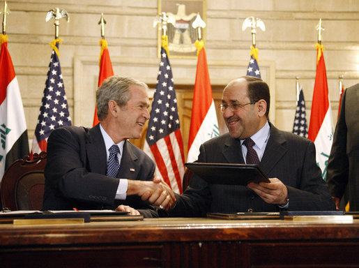 Then U.S. President George W. Bush and Iraqi Prime Minister Nuri al-Maliki in Baghdad December 2008. / Credit:White House photo by Eric Draper (Public domain), via Wikimedia Commons