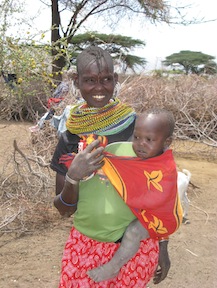 A pregnant woman in Kenya's North Eastern Province with one of her children. Overpopulation in the area contributes to poor maternal health.  / Credit:Isaiah Esipisu/IPS