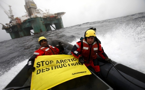 Greenpeace executive director Kumi Naidoo (left) before boarding the Cairn Energy oil platform in the Arctic, 120 km from the Greenland coast. / Credit:Jiri Rezac/Greenpeace