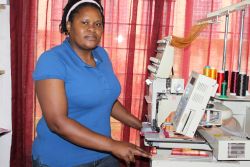 Futhi Mngomezulu operating her embroidery machine. - Mantoe Phakathi/IPS