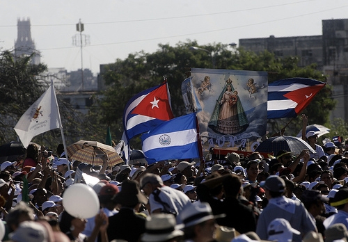 An image of the Virgin Mary next to Cuban flags in the Plaza de la Revolución.  - Jorge Luis Baños/IPS 