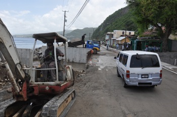 Workers build a sea defence wall in the Scott's Head Community on Dominica's south coast.  - Desmond Brown/IPS