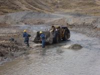 Caudalosa workers clean up mining tailings in the Opamayo River.  - Milagros Salazar/IPS