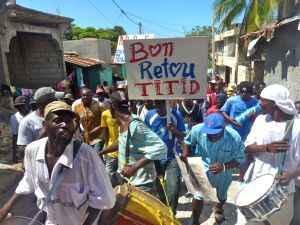 Fanmi Lavalas march for Aristide's return descends from Bel-air on Feb. 18. - Ansel Herz/IPS