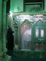 A Sufi follower seeks blessings at the shrine of Sayyida Ruqqaya in Cairo. - Cam McGrath