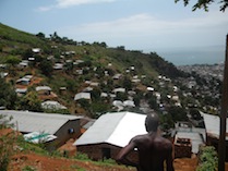 Houses are climbing up Freetown's surrounding hillsides as government fails to enforce laws to protect soil stability in Sierra Leone's largest city. - Abdul Samba Brima and Jessica McDiarmid
