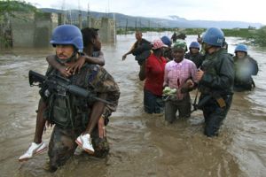 UN peacekeepers rescue Haitian children from an orphanage destroyed by Hurricane Ike in September 2008. / Credit:UN Photo/Marco Dormino