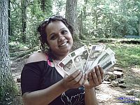 Esha Gordon holds up Berkshare currency. / Credit:Matthew Cardinale/IPS