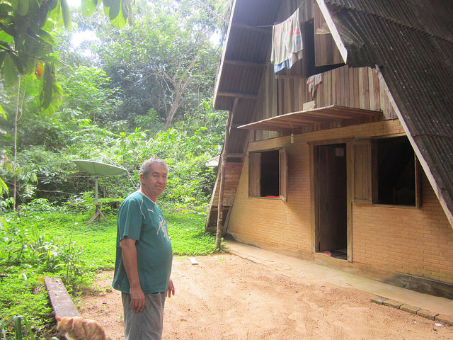 Cacao farmer José Tinte Zeferino, known as “Cido”, in front of his house, which is hidden by dense vegetation and surrounded by his cacao trees, in the municipality of Brasil Novo, near the Xingú river and the Trans-Amazonian highway. Credit: Mario Osava/IPS