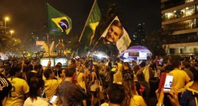 Supporters of president-elect Jair Bolsonaro celebrate his triumph in the early hours of Oct. 29, in front of the former captain's residence on the west side of Rio de Janeiro. The far-right candidate garnered 55.13 percent of the vote and will begin his four-year presidency on Jan. 1, 2019. Credit: Fernando Frazão/Agencia Brasil