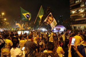 Supporters of president-elect Jair Bolsonaro celebrate his triumph in the early hours of Oct. 29, in front of the former captain's residence on the west side of Rio de Janeiro. The far-right candidate garnered 55.13 percent of the vote and will begin his four-year presidency on Jan. 1, 2019. Credit: Fernando Frazão/Agencia Brasil