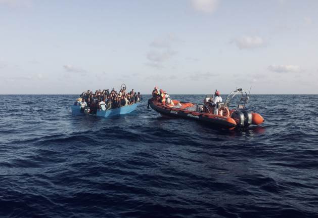 Migrants somewhere in the central Mediterranean are contacted by the Open Arms crew. Credit: Karlos Zurutuza / IPS