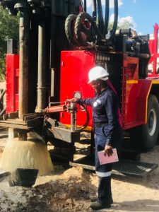 Alina Kadhila, a hydrogeologist at Namibia Water Corporation, operating a mud rotary drilling rig. Credit: Alina Kadhila