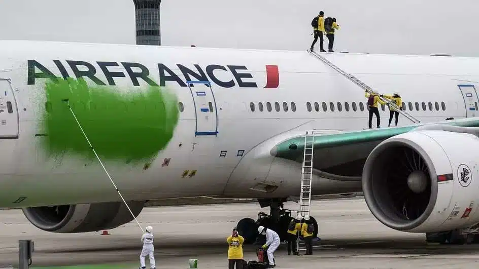 In March 2021, environmentalists from Greenpeace threw green paint on the fuselage of an Air France plane at Paris airport to protest the company's purchase of carbon credits. Major firms purchased the offsets without backtracking on the expansion of carbon-intensive operations. Credit: Fenis Meyer / Greenpeace