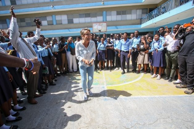 Yasmine Sherif, Education Cannot Wait Executive Director, interacts with students at Lycée National de Petion Ville, where, thanks to ECW investments, students are benefiting from catch-up classes and accelerated education programmes. Credit: ECW